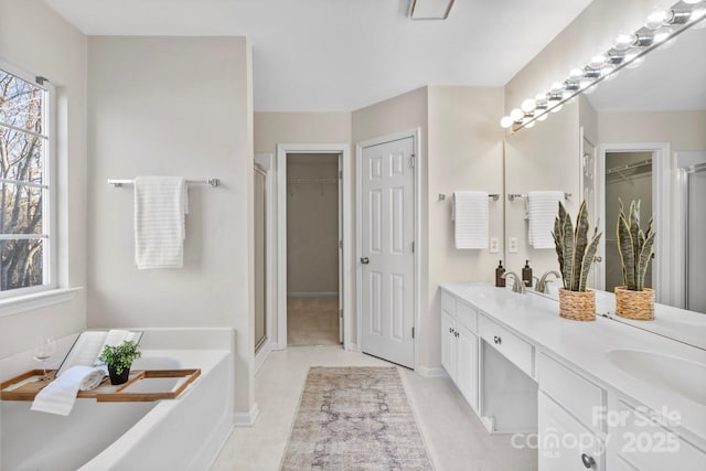 bathroom with vanity, plenty of natural light, and shower with separate bathtub