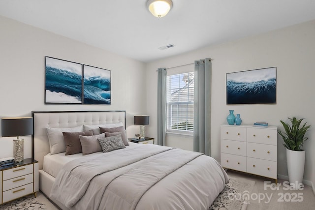 bedroom featuring light carpet