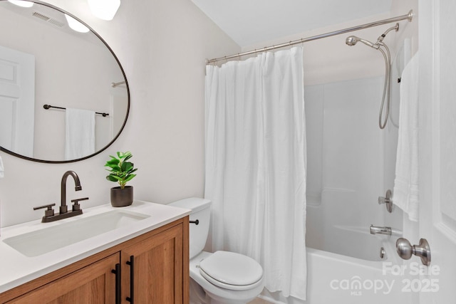 full bathroom featuring vanity, toilet, and shower / bath combo with shower curtain