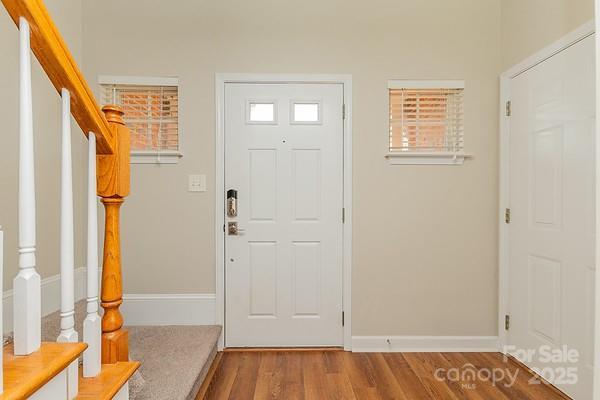 foyer featuring wood-type flooring