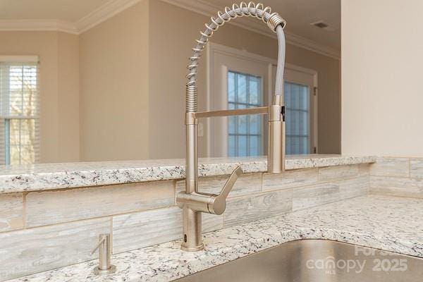 details with light stone counters and ornamental molding