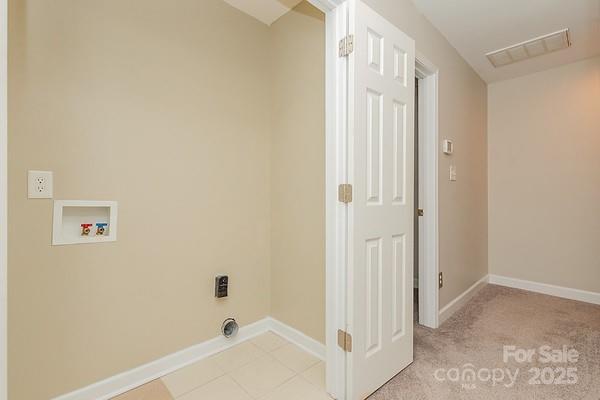 clothes washing area featuring washer hookup and electric dryer hookup