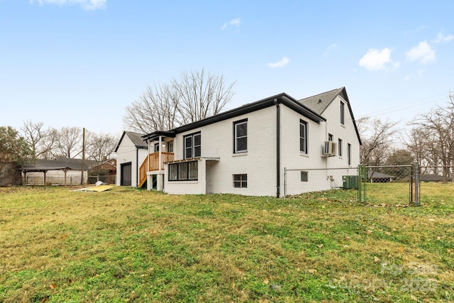 view of home's exterior featuring central AC and a lawn