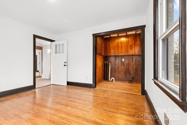 unfurnished room featuring light hardwood / wood-style floors