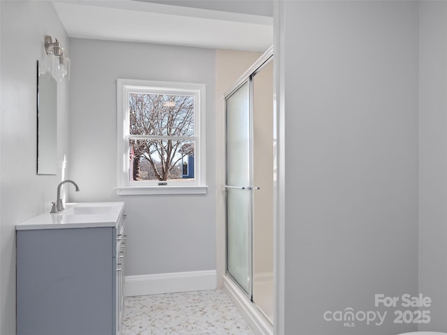 bathroom featuring vanity and an enclosed shower