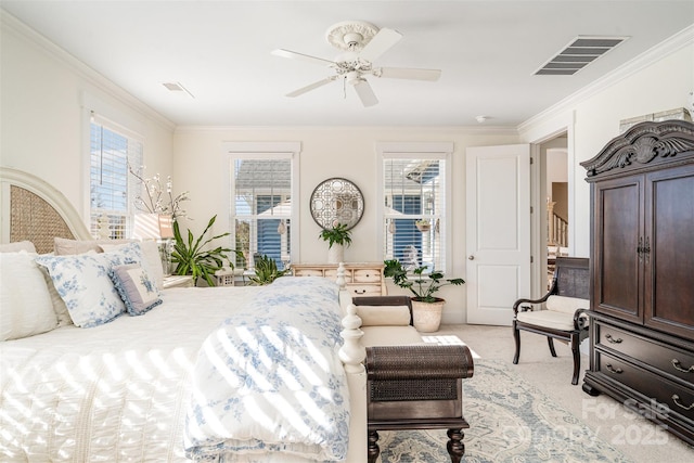 bedroom featuring multiple windows, ornamental molding, and light colored carpet