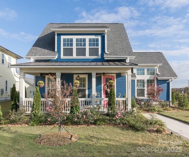 view of front of home featuring a front yard and covered porch