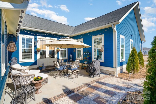 rear view of property with a patio area