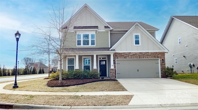 craftsman house with a shingled roof, concrete driveway, an attached garage, board and batten siding, and stone siding