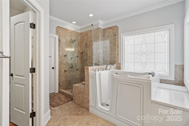 bathroom with ornamental molding and separate shower and tub