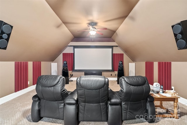 carpeted home theater room featuring vaulted ceiling and ceiling fan