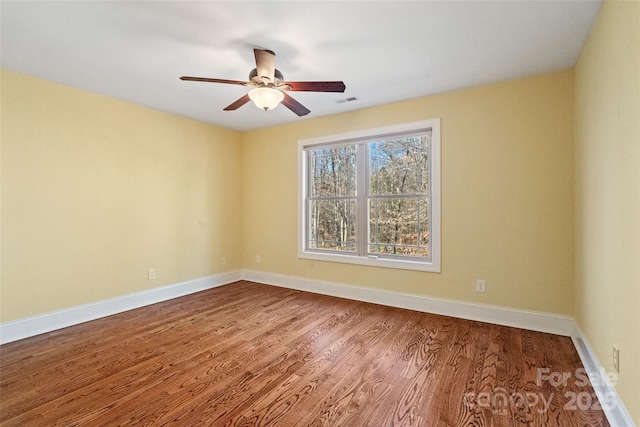 unfurnished room featuring ceiling fan and wood-type flooring