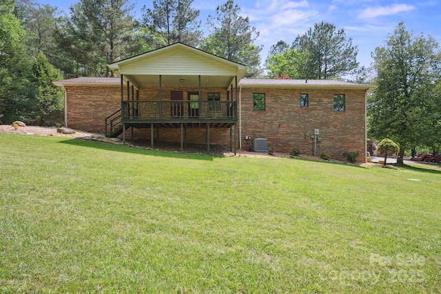 2076 Jay Clark Rd, Morganton, NC 28655 - rear view of property featuring brick siding, a lawn, and central AC