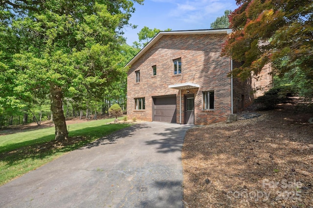2076 Jay Clark Rd, Morganton, NC 28655 - view of front of property featuring an attached garage, brick siding, and aphalt driveway