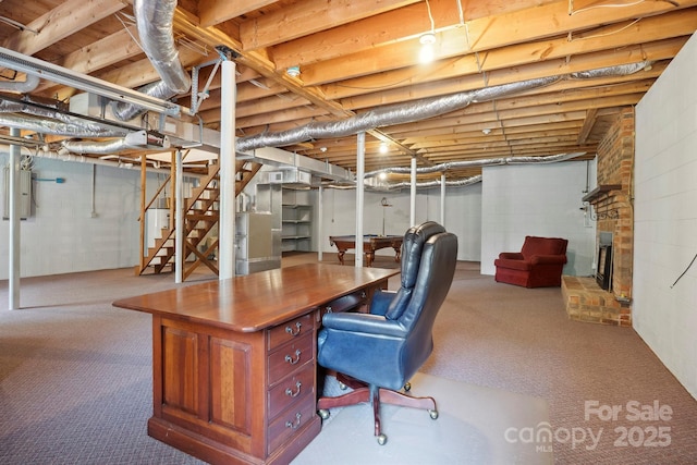 2076 Jay Clark Rd, Morganton, NC 28655 - carpeted home office featuring a brick fireplace and concrete block wall