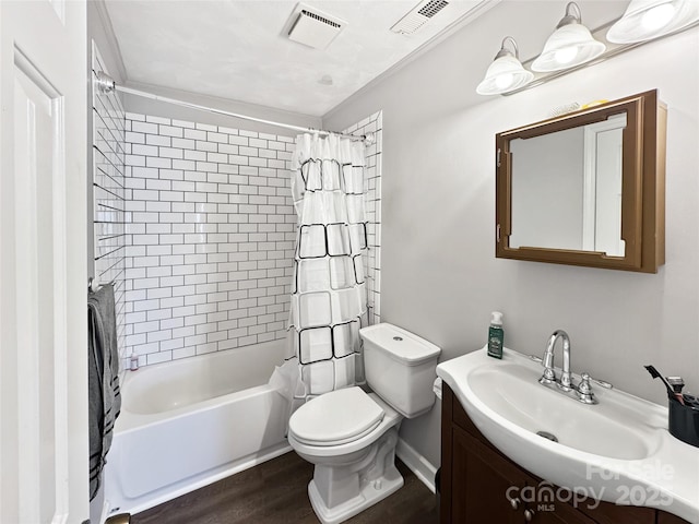 full bathroom with vanity, hardwood / wood-style floors, toilet, and shower / bath combo with shower curtain