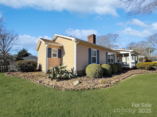 view of property exterior featuring a porch and a yard