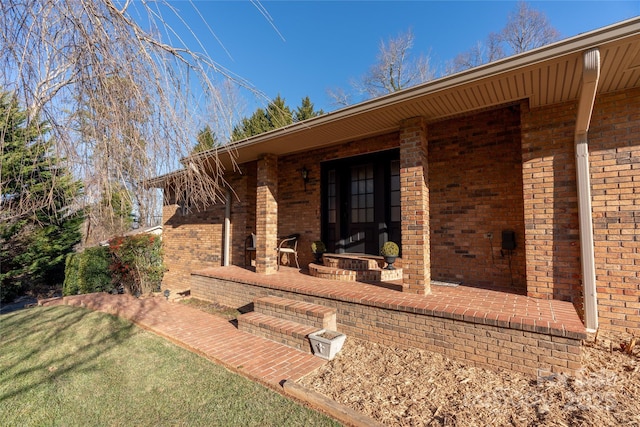 exterior space featuring a patio and a lawn