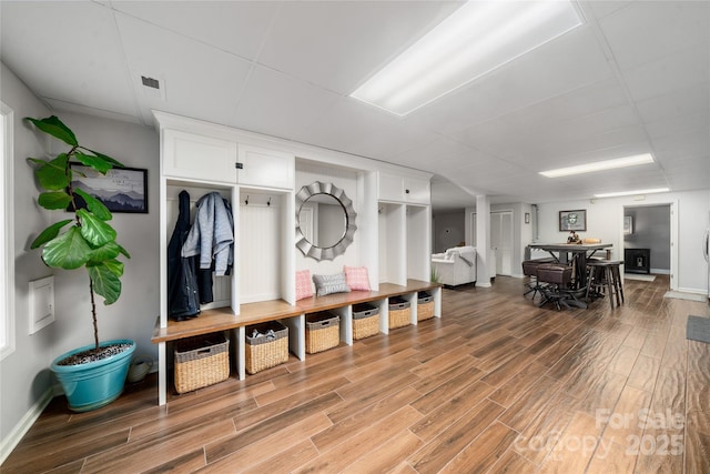 mudroom with hardwood / wood-style flooring and a paneled ceiling