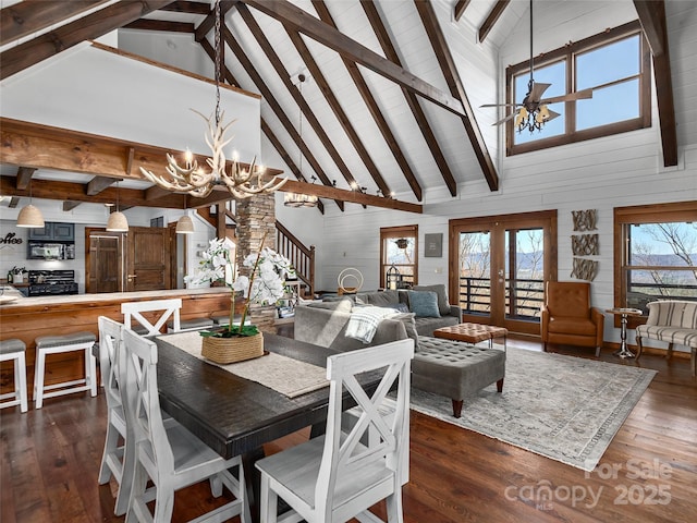 25 Crestwood Dr, Arden, NC 28704 - dining area with high vaulted ceiling, a chandelier, dark wood finished floors, beamed ceiling, and french doors
