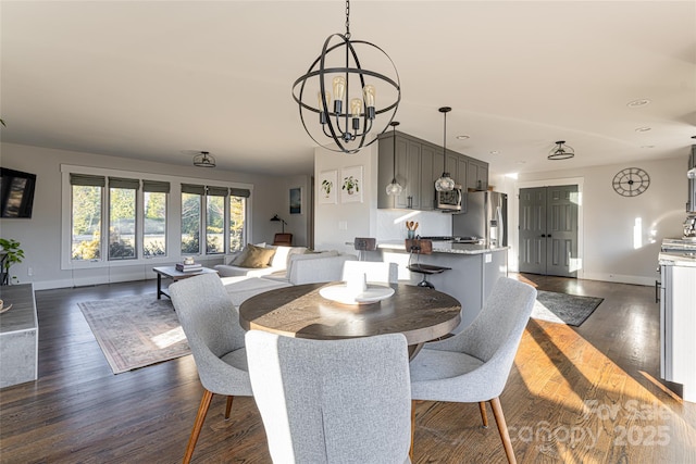 dining room featuring dark hardwood / wood-style floors and a notable chandelier