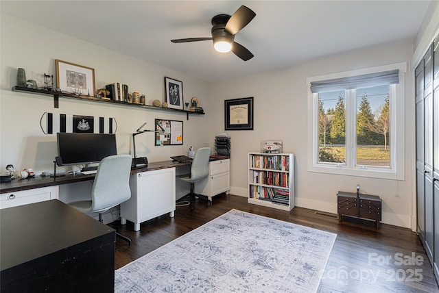 office area featuring dark hardwood / wood-style floors and ceiling fan