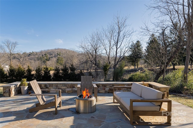 view of patio with a fire pit