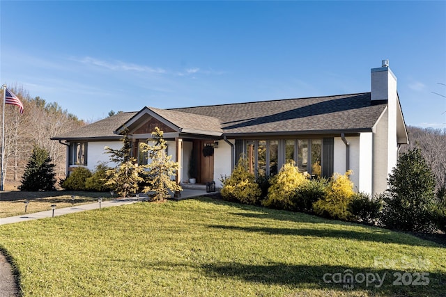 ranch-style home featuring a front yard