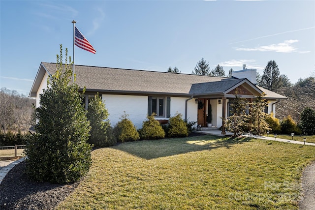 ranch-style house featuring a front lawn