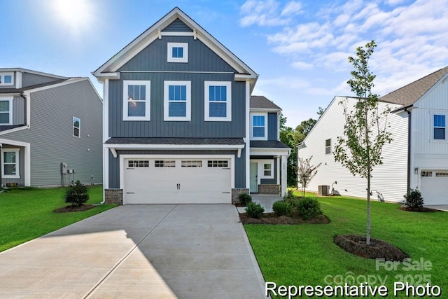 craftsman inspired home with a garage, central AC unit, and a front yard