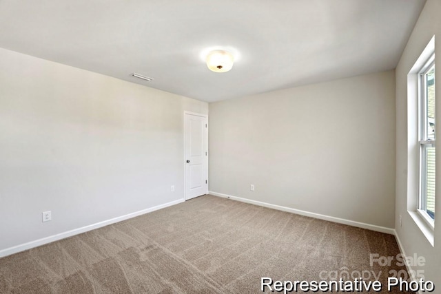 view of carpeted spare room