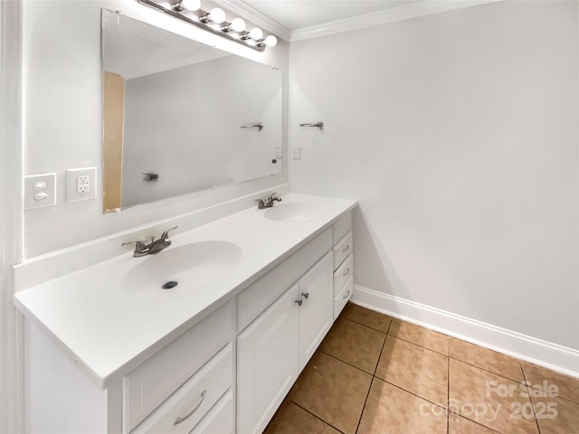 bathroom featuring tile patterned flooring, vanity, and crown molding