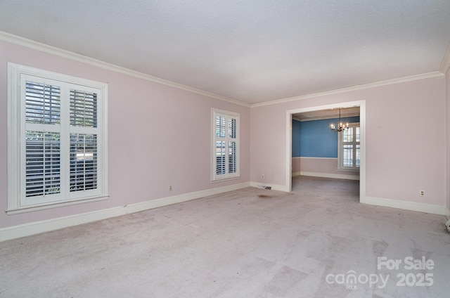 spare room featuring crown molding, light carpet, and a notable chandelier