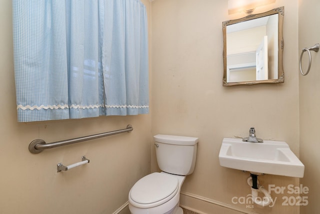 bathroom with toilet and sink