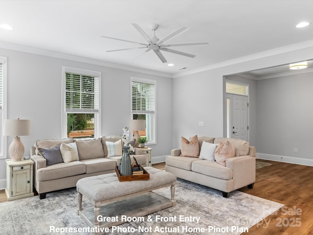 living room featuring wood-type flooring, ornamental molding, and ceiling fan