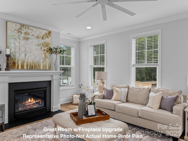 living room featuring crown molding, ceiling fan, and hardwood / wood-style flooring