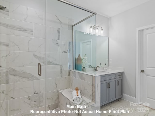 bathroom with vanity and a shower with shower door