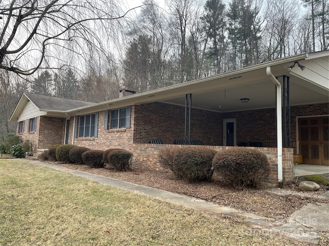 view of home's exterior with a yard