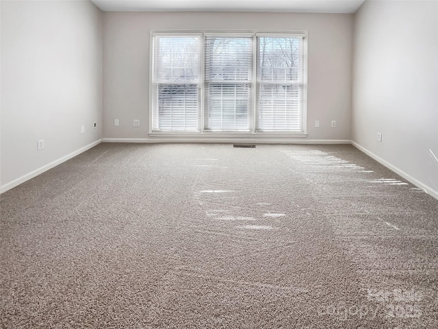 empty room featuring carpet flooring