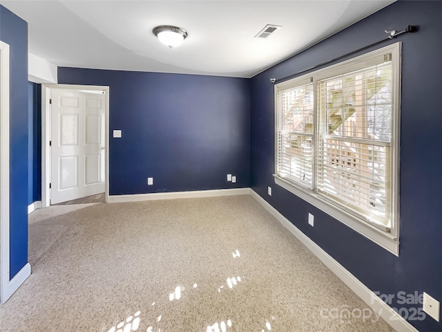 empty room with carpet flooring