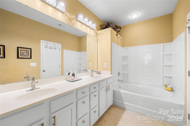 bathroom with vanity, tile patterned flooring, and shower / washtub combination