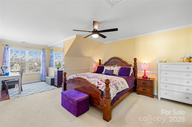 carpeted bedroom featuring crown molding and ceiling fan