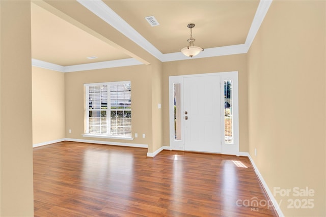 entrance foyer featuring ornamental molding and wood-type flooring