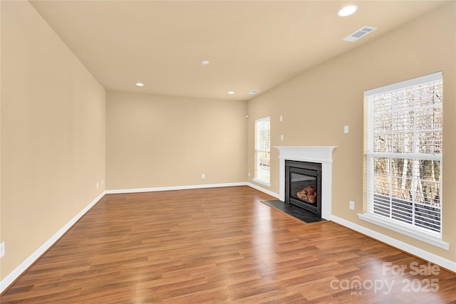 unfurnished living room featuring hardwood / wood-style floors