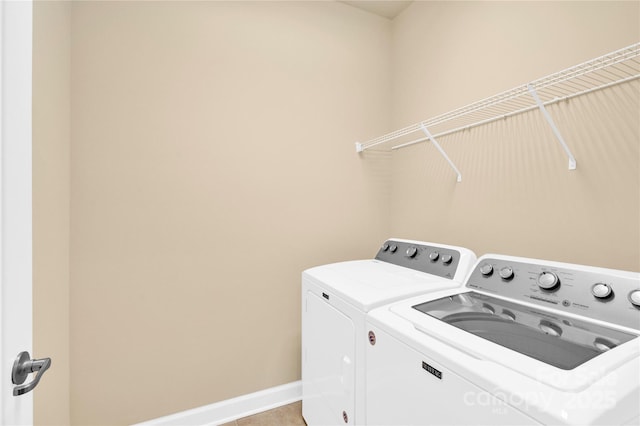 laundry room with washing machine and dryer