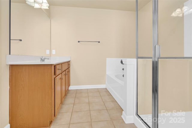 bathroom featuring vanity, tile patterned floors, and separate shower and tub