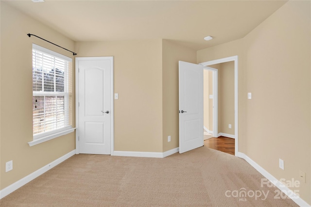 unfurnished bedroom featuring carpet