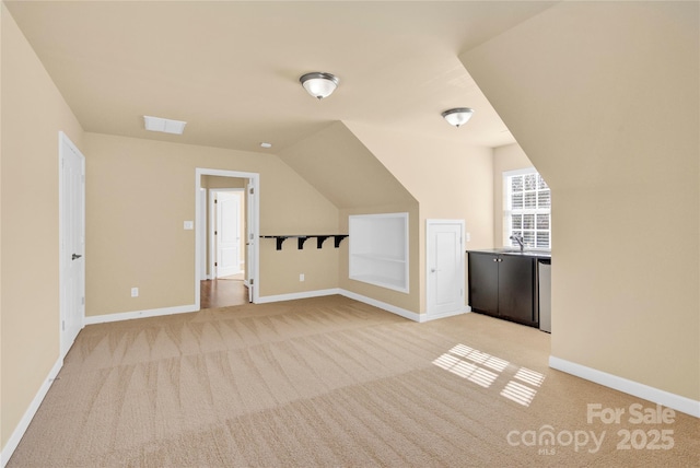 additional living space featuring light colored carpet