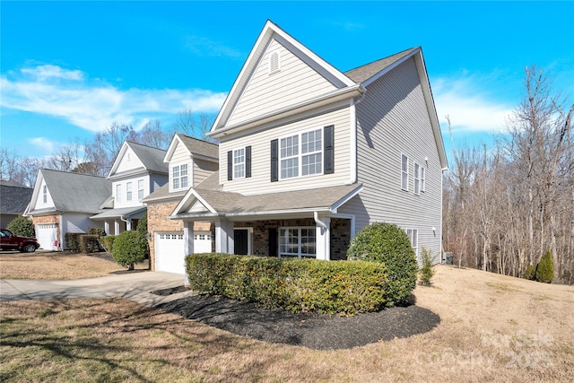 view of front facade featuring a garage and a front lawn