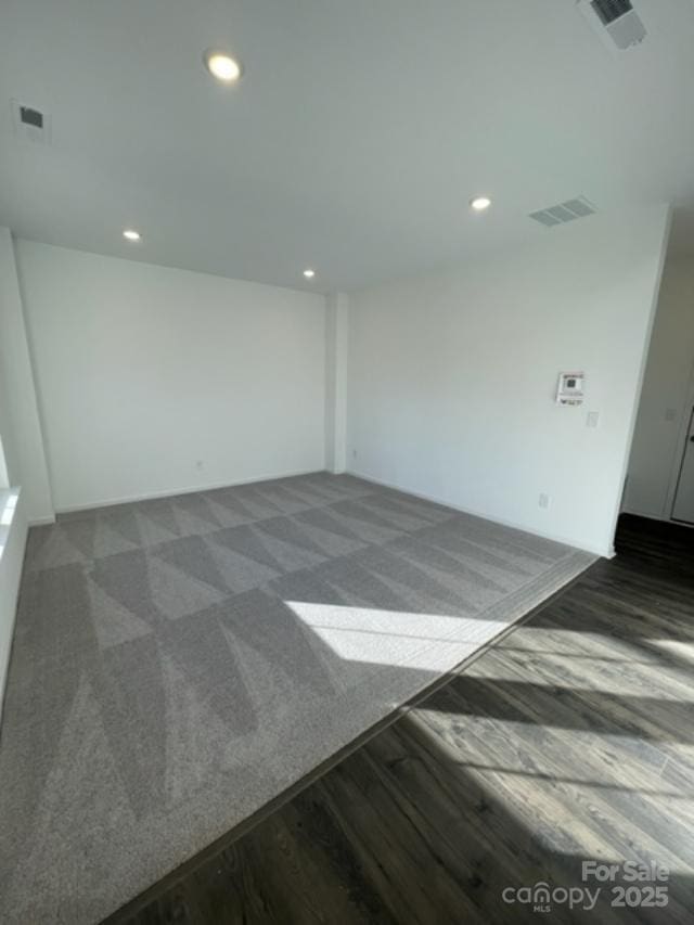 empty room featuring dark wood-type flooring